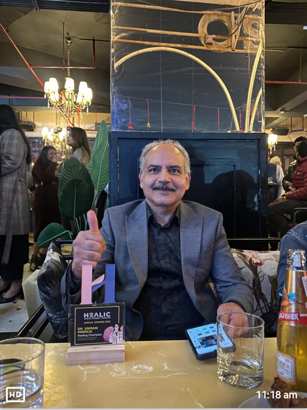 Dr. Vikram Pabreja with the HEALIC Healing Champion trophy